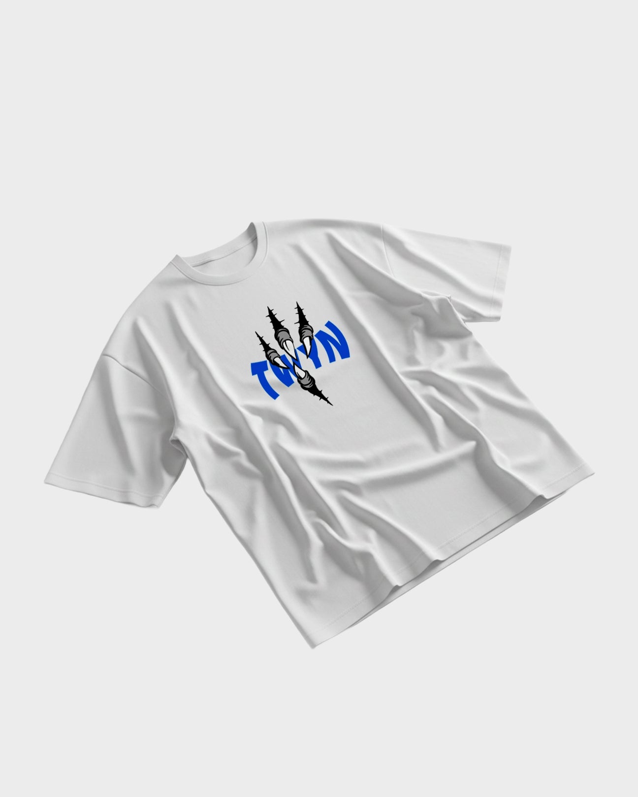 White TWYN oversized t-shirt with blue claw-mark logo displayed on a flat lay